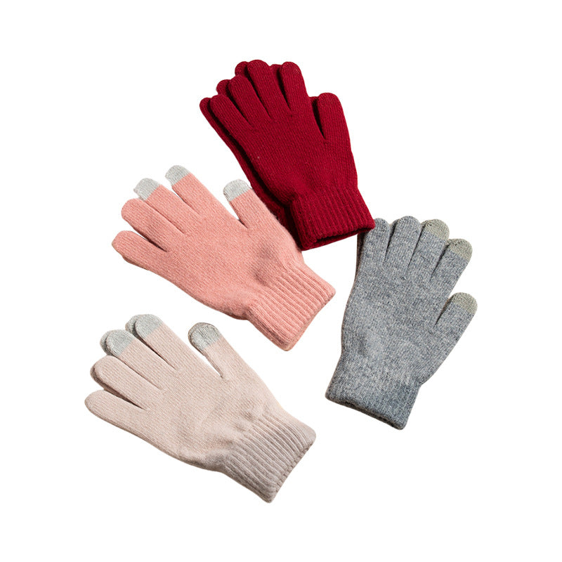 Four pairs of knit winter gloves: wine red, blush pink, beige, and light gray