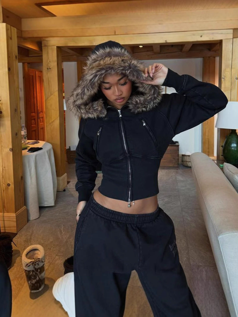 Black cropped zip hoodie jacket with faux-fur hood, long sleeves, drawstring hem