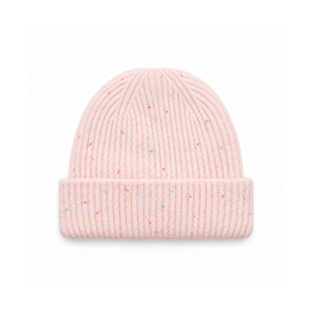 Pink speckled rib-knit beanie with a wide folded cuff, front view.