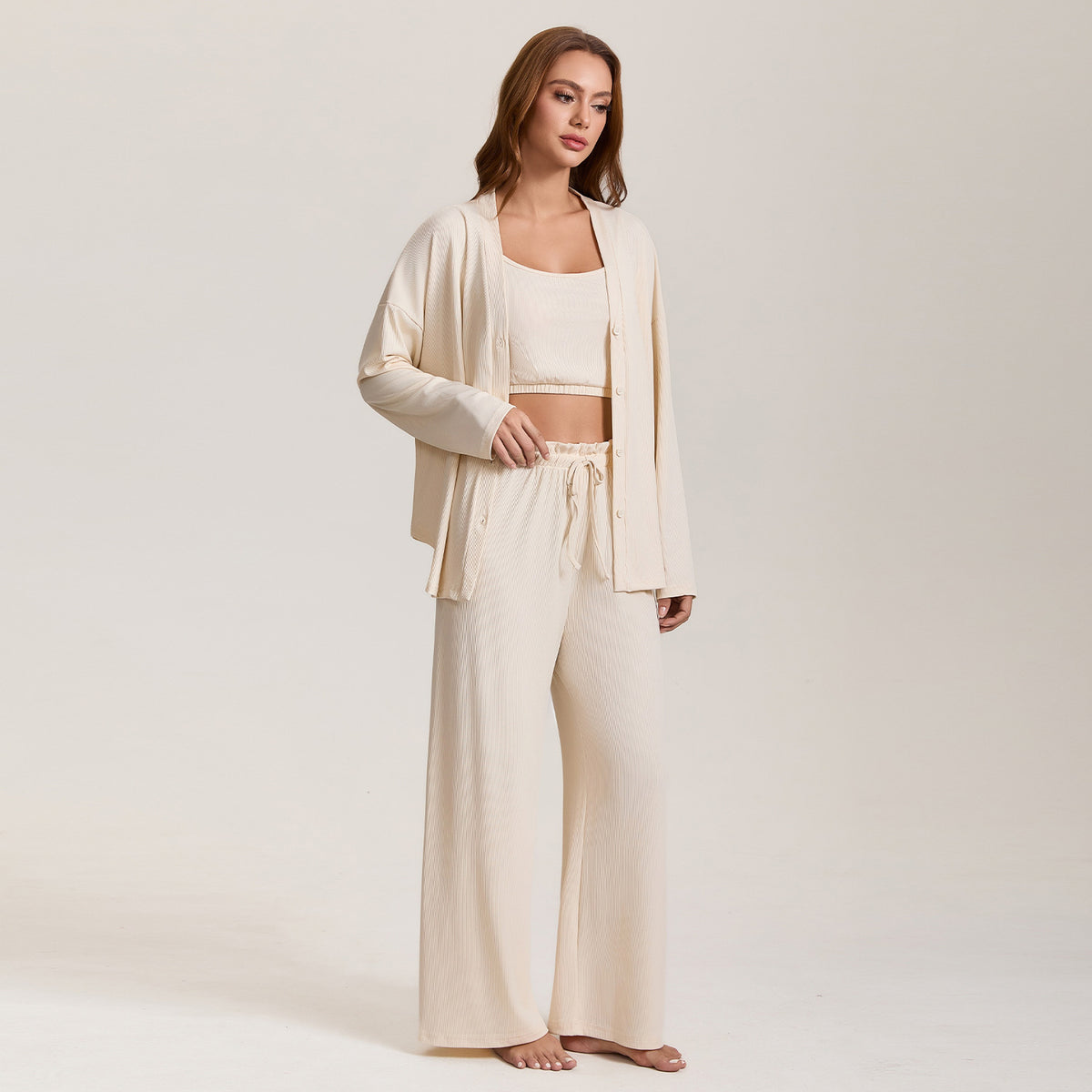 Women’s cream pajama three-piece set with long-sleeve lounge jacket and wide-leg pants