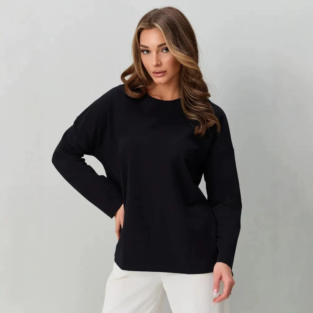 Black long-sleeve cotton top with a round neck and relaxed fit