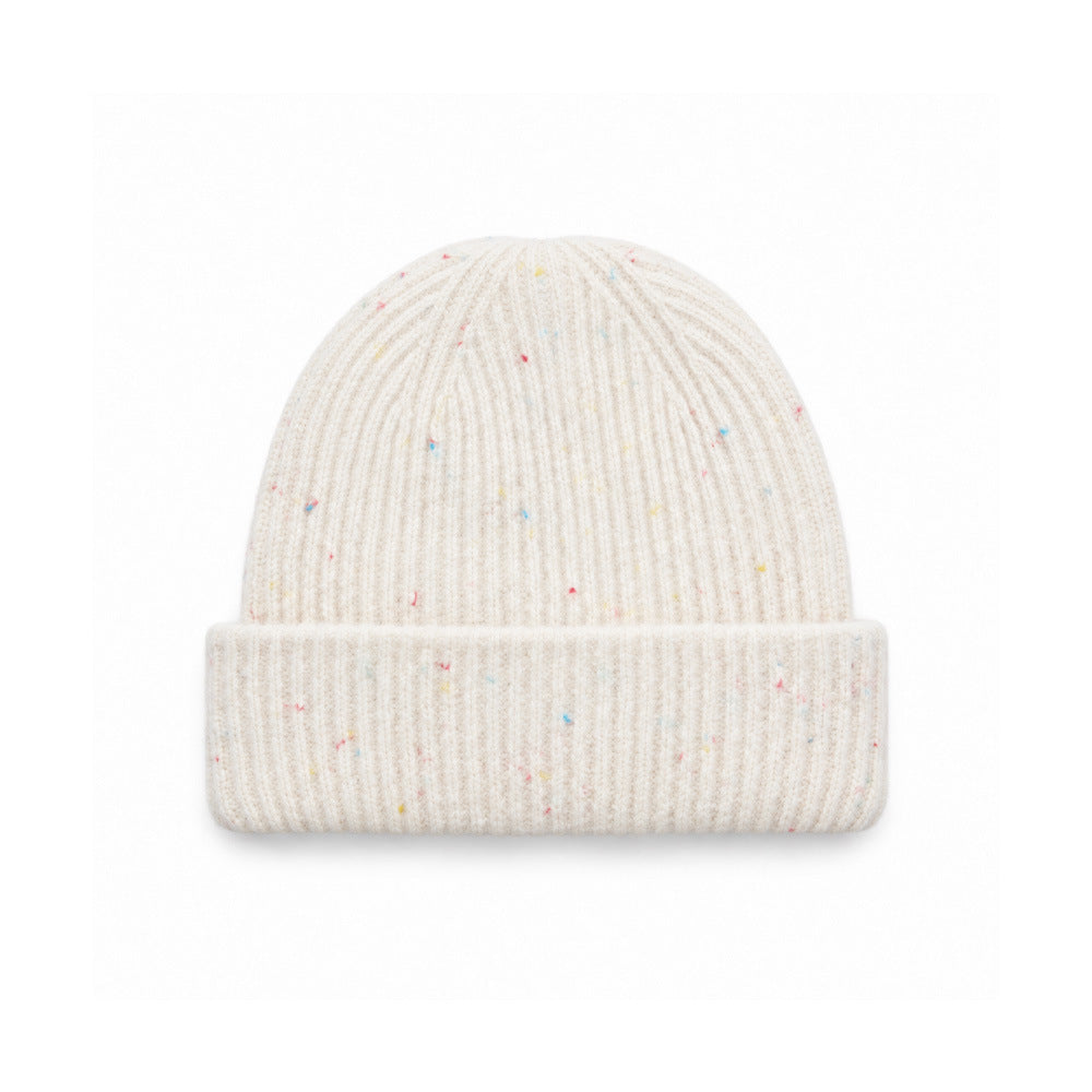 White speckled rib-knit beanie with a wide folded cuff, front view.