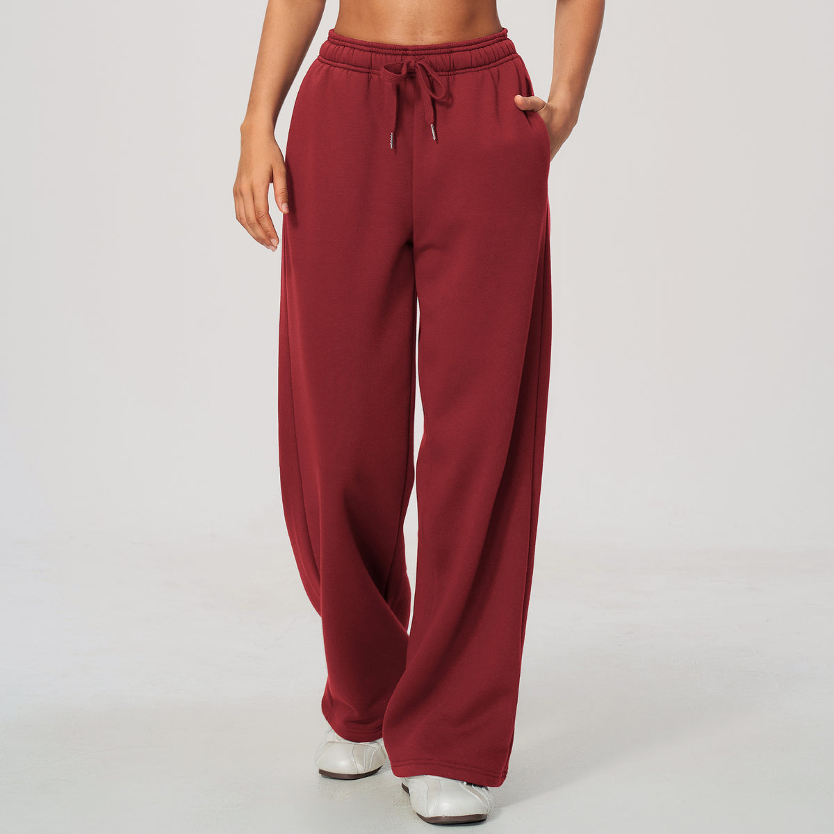 Red high-waisted sweatpants with elastic waistband and drawstring, relaxed wide-leg