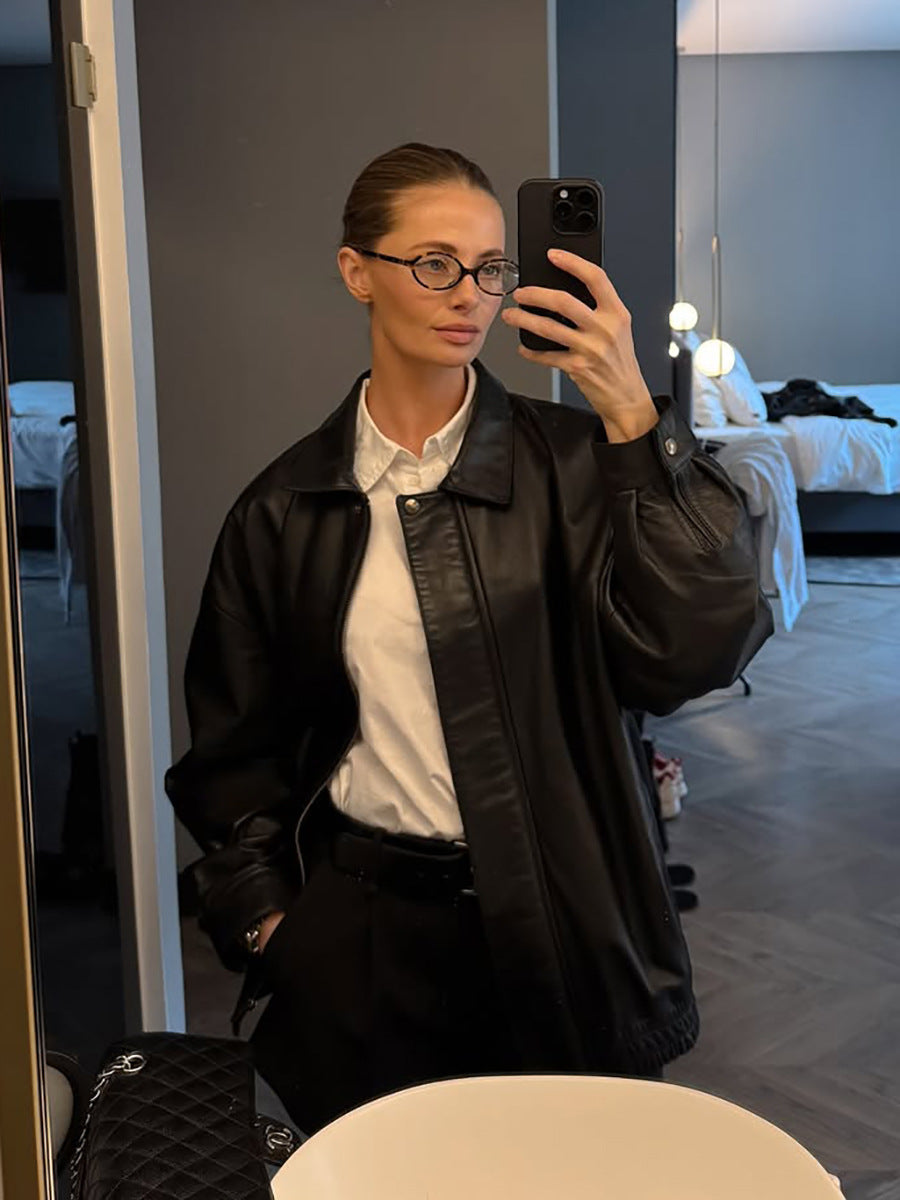 Black matte leather jacket with lapel collar, long sleeves, zip front