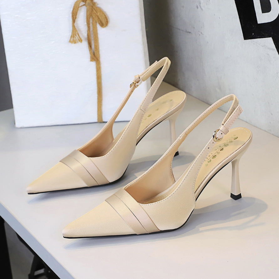 Champagne satin pointed-toe stiletto slingback heels with cut-out back strap