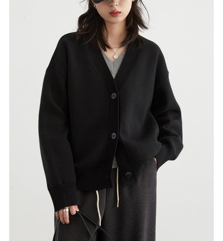 Black V-neck cardigan sweater with button front and ribbed trim, long sleeves