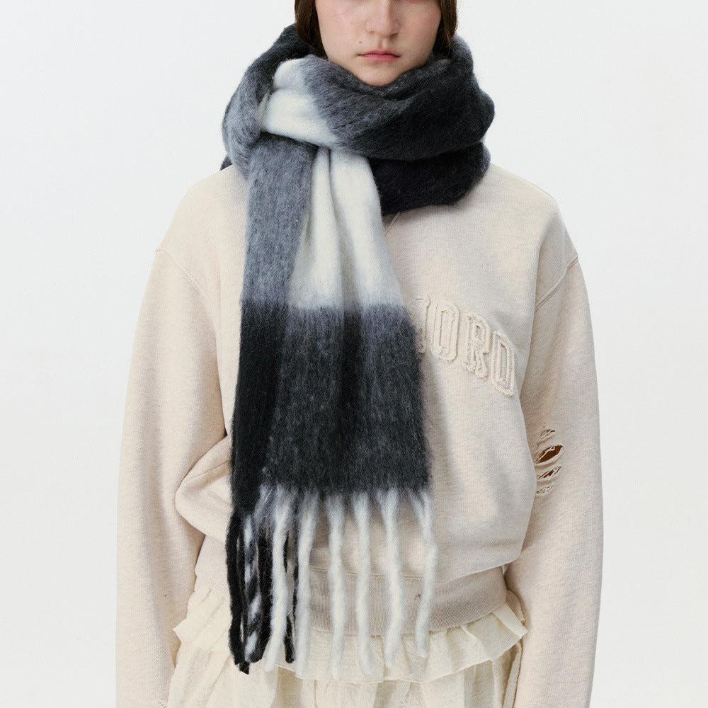 Women’s plaid scarf in dark gray and white with soft texture and long fringe
