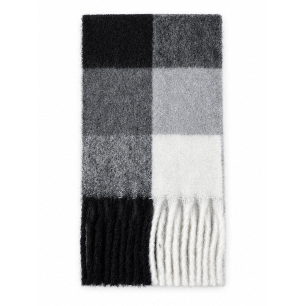 Large plaid scarf with black, gray, and white blocks and fringed ends
