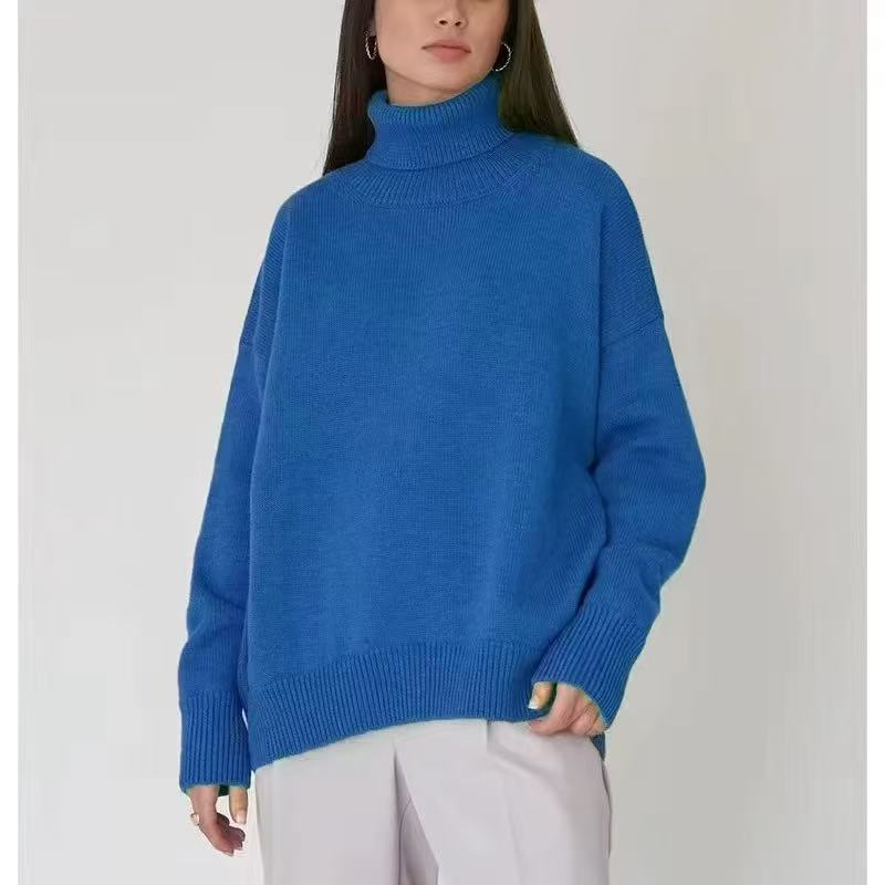 Oversized blue turtleneck sweater with ribbed knit collar and relaxed wide sleeves