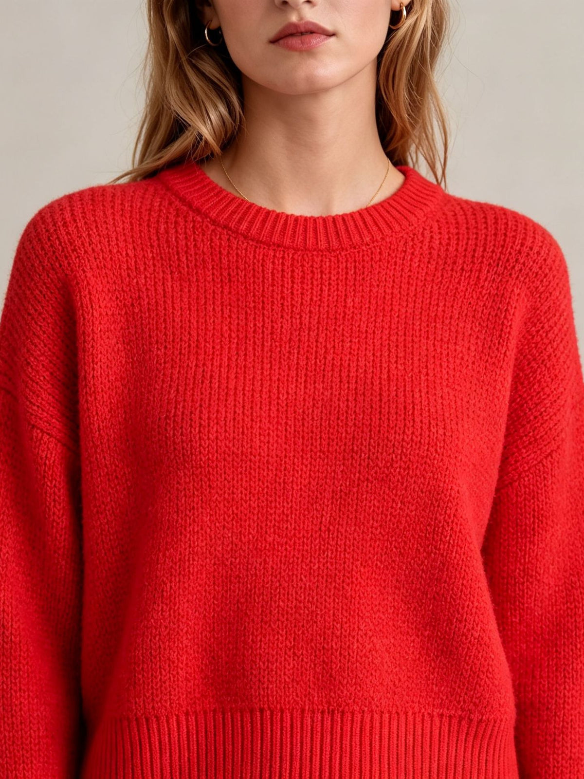 Red knit pullover sweater with crew round neck, long sleeves, ribbed hem and cuffs