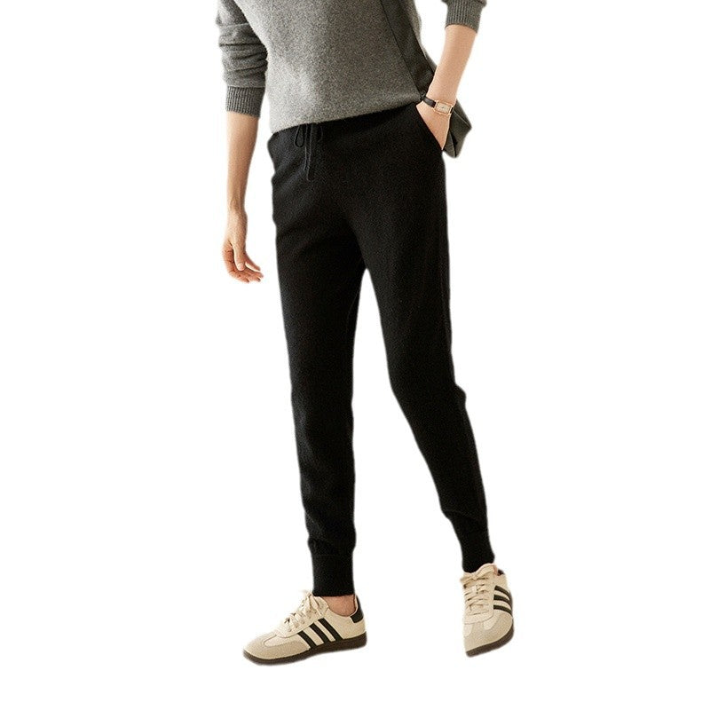 Black cashmere-knit jogger pants with drawstring waist and tapered slim legs