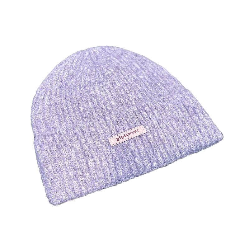 Lavender knit beanie hat with ribbed brim and small pipiswoot logo patch