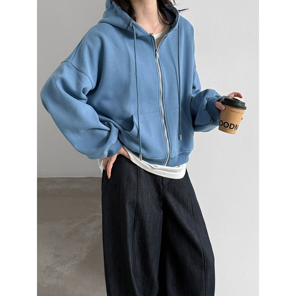 Women’s zip-up hooded sweatshirt in light blue with drawstring hood and front zipper