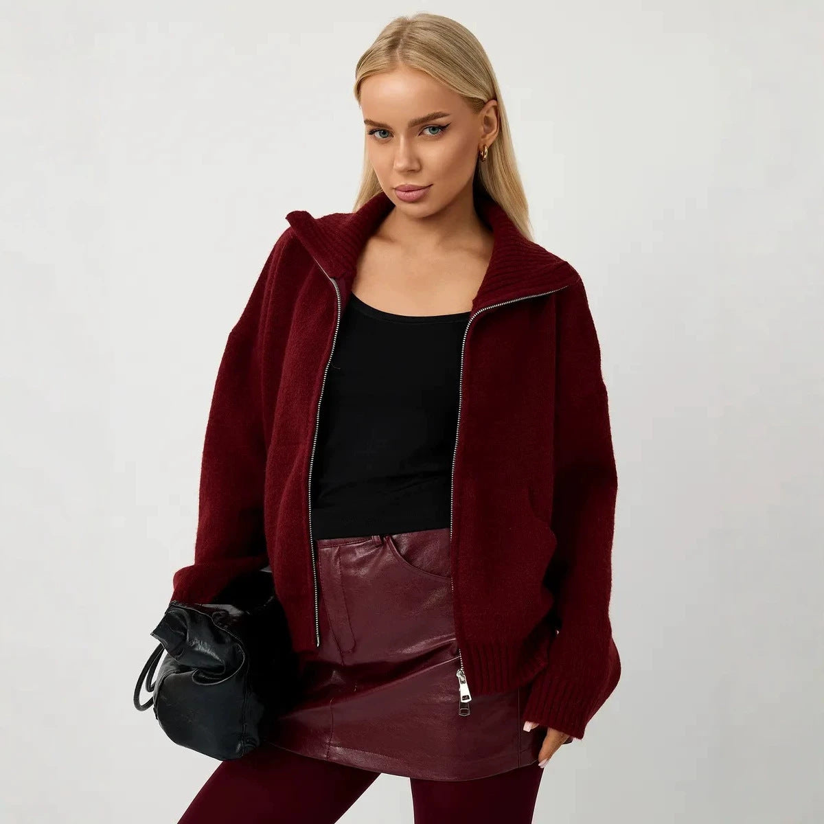 Women’s burgundy knitted zip-up cardigan with stand-up collar and ribbed cuffs