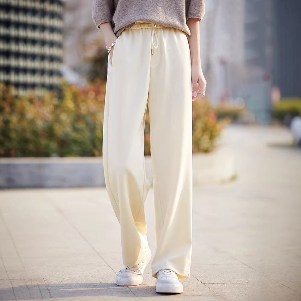 Women’s off-white wide-leg pants with elastic waist and drawstring, drapey straight legs