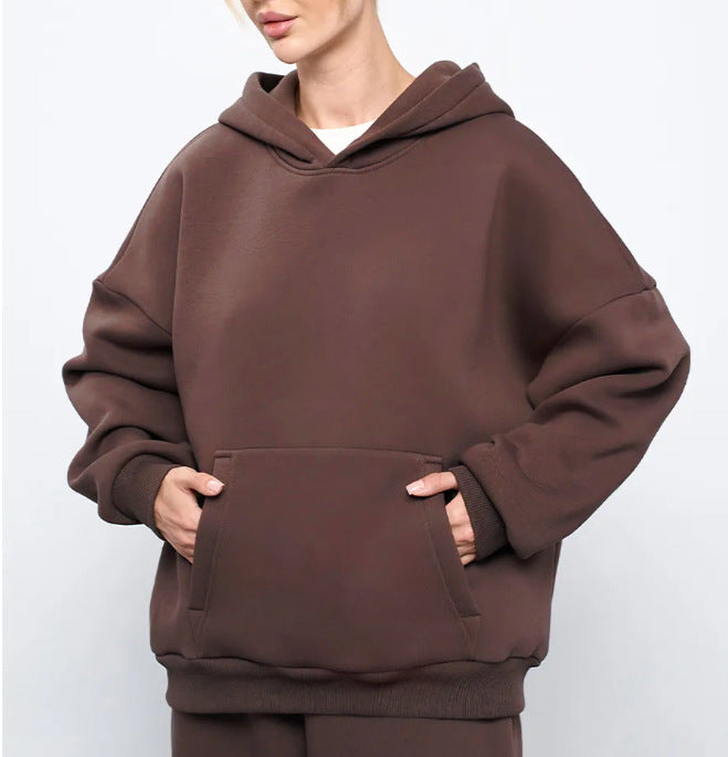 Dark brown women’s hooded sweatshirt with front kangaroo pocket and loose fit