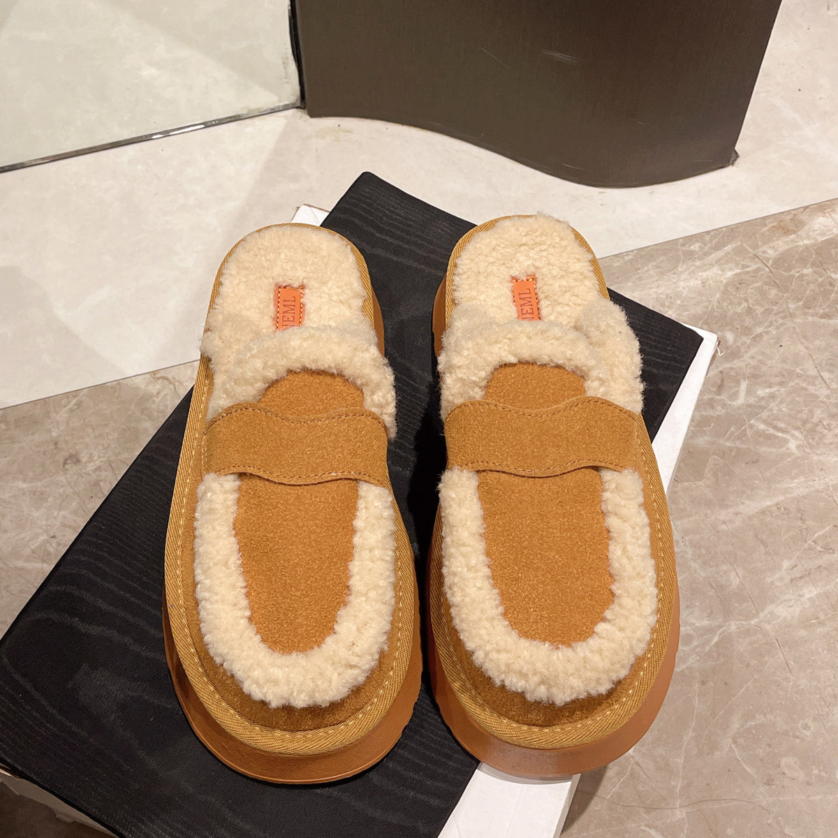 Fur-lined platform clogs with back strap, black and brown faux suede with beige lining