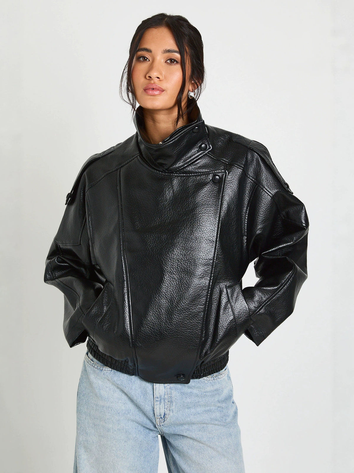 Black PU leather stand-up collar jacket with zip and biker-style short cut.