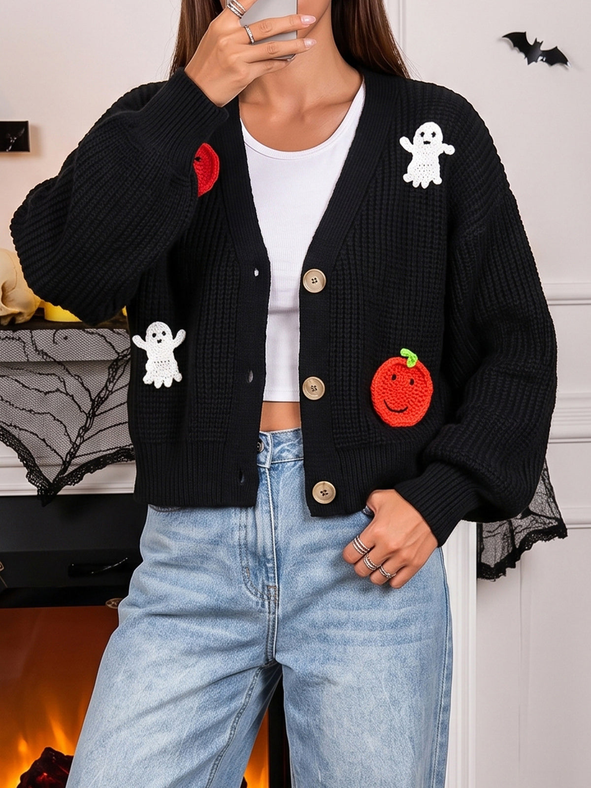 Black knit cardigan with button front and red pumpkin & white ghost appliques