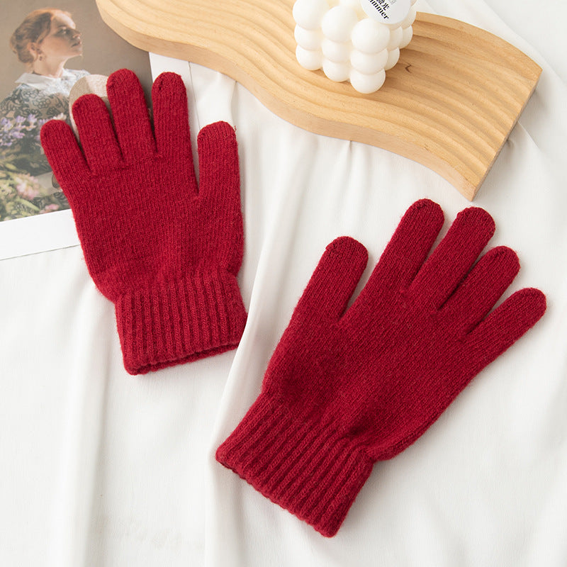 Wine red knit gloves with ribbed cuffs and full-length fingers