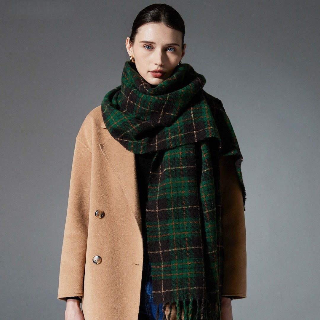 Green plaid faux cashmere scarf, fringed border draped on model