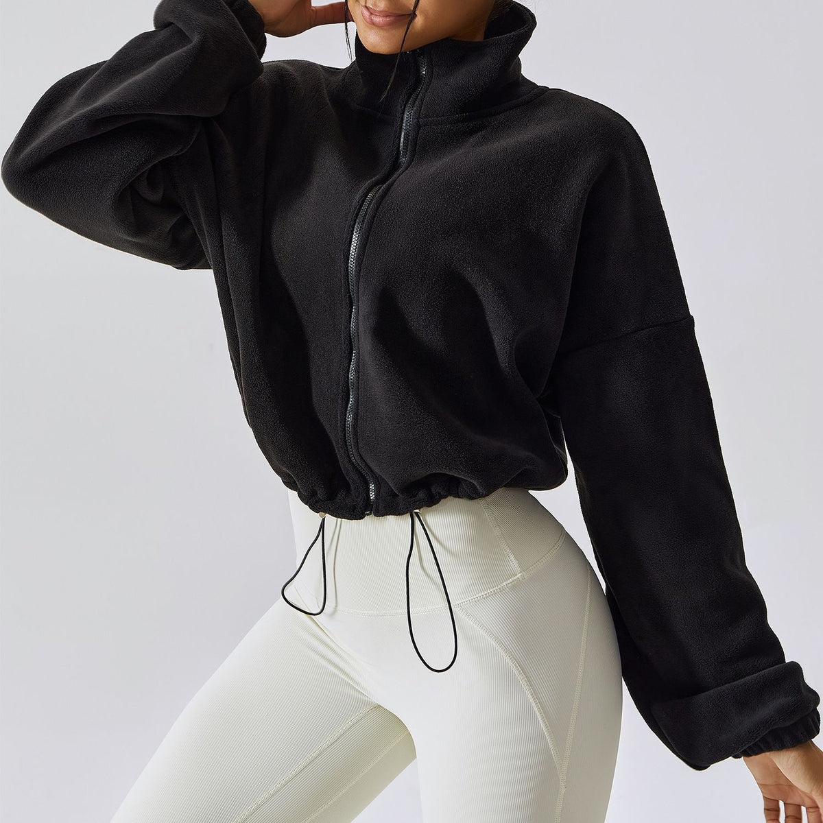 Women’s fleece-lined jacket in black, front full-zip stand collar, drawstring hem