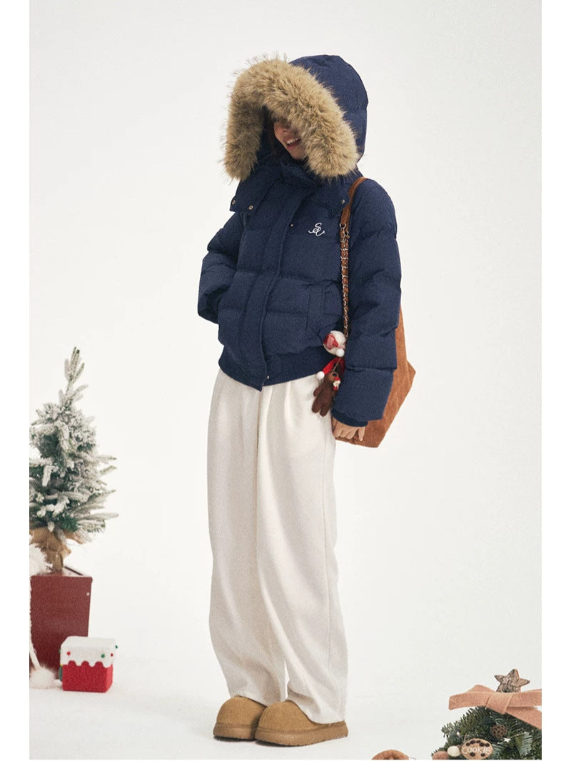 Women's navy puffer jacket with fur-trim hood, zip front and front patch pockets