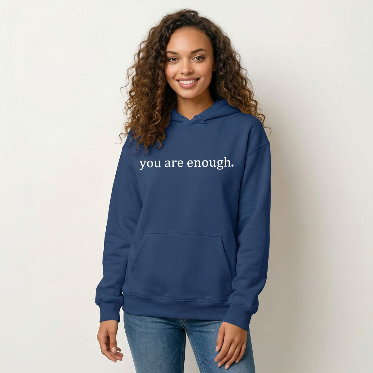 Navy blue women’s hoodie sweatshirt with hood, front pocket, and 'you are enough' print.