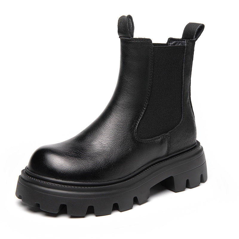Black Chelsea boot with elastic side panels and chunky lugged platform sole