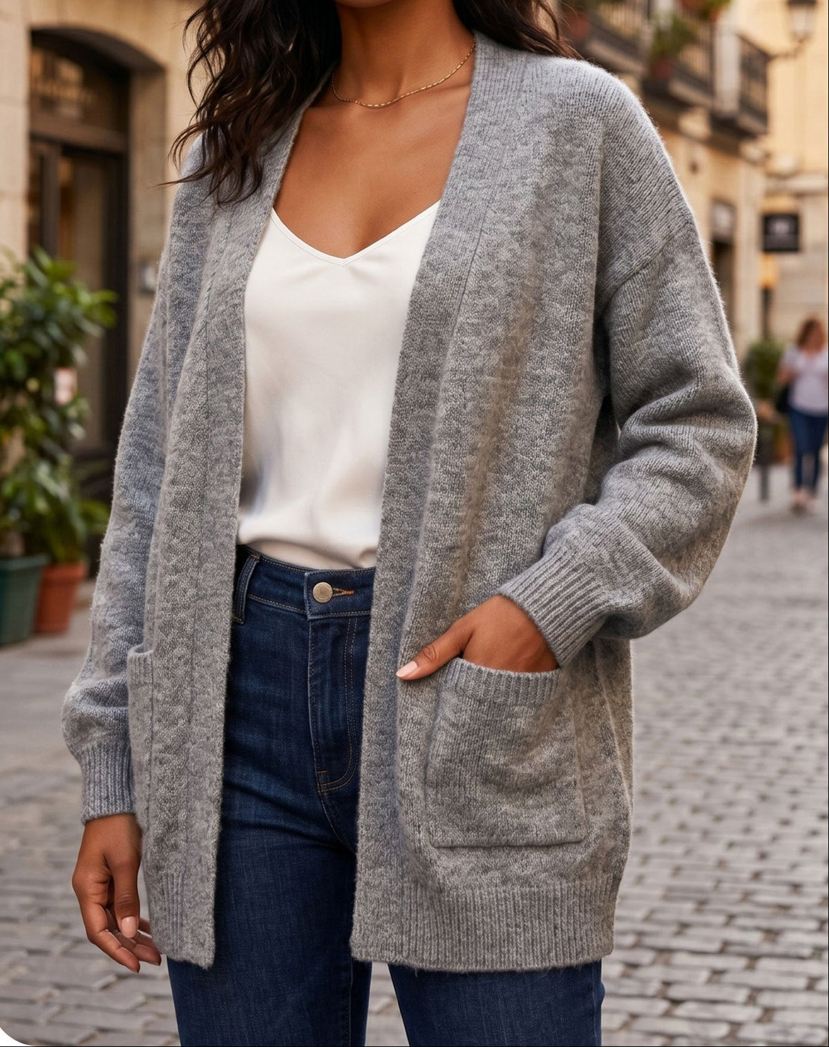 Gray knitted long cardigan with ribbed cuffs and front pockets, open front