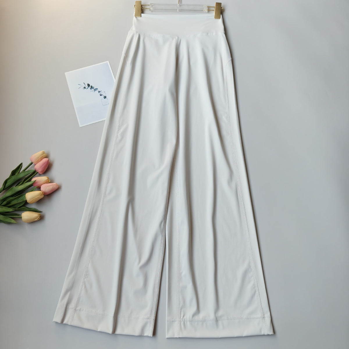 White high-waisted wide-leg yoga pants, full-length relaxed drape