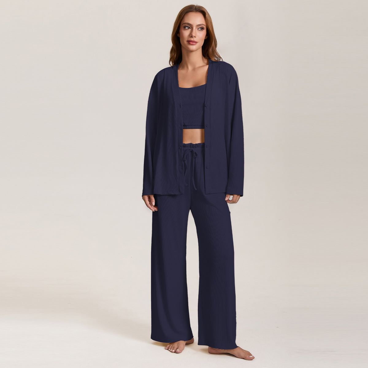 Women’s navy pajama three-piece set with long-sleeve lounge jacket and wide-leg pants
