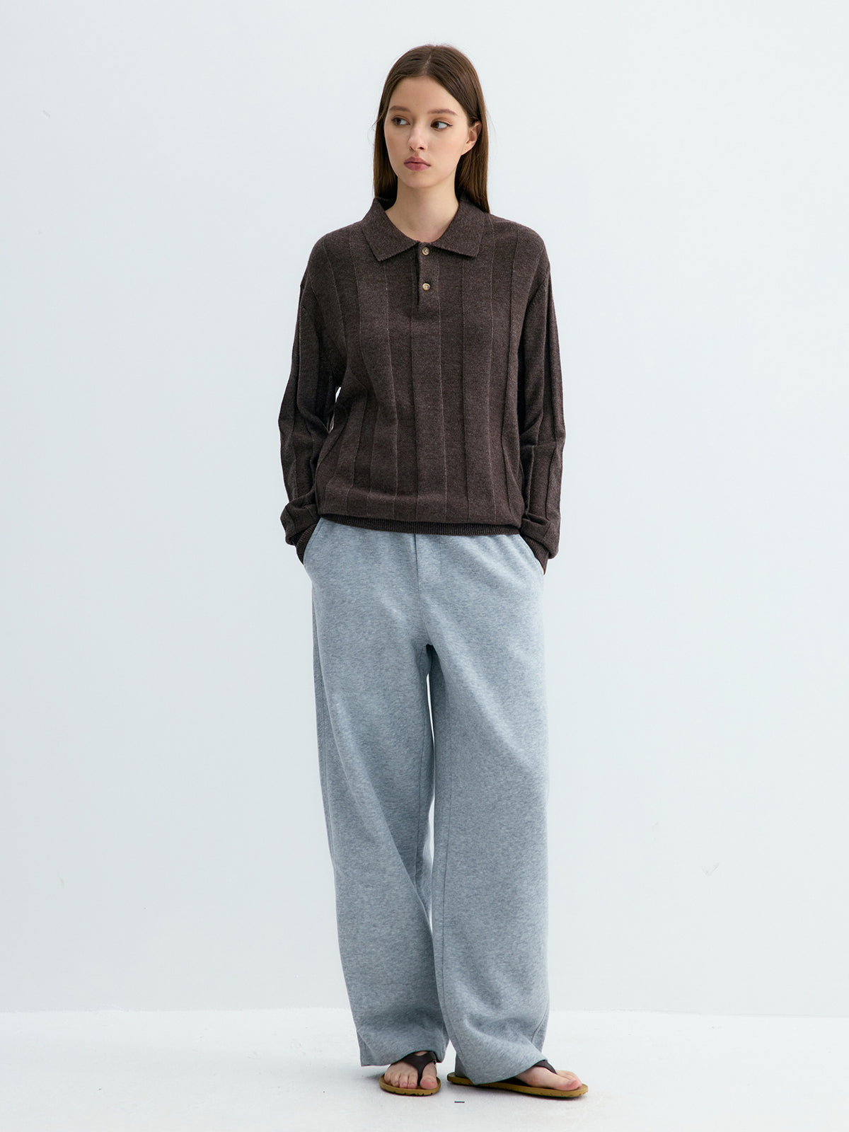 Light gray loose draped knit sweatpants with straight wide legs and elastic waistband