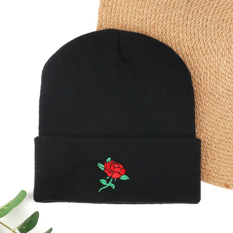 Black knit beanie with red rose embroidery
