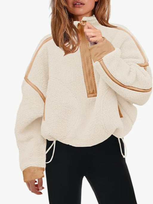 Plush quarter-zip sweatshirt in cream with tan trim and pull tab