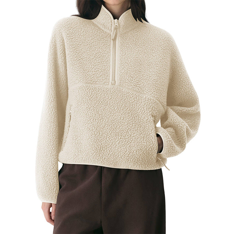 Women’s cream fleece quarter-zip pullover with front pocket and long sleeves