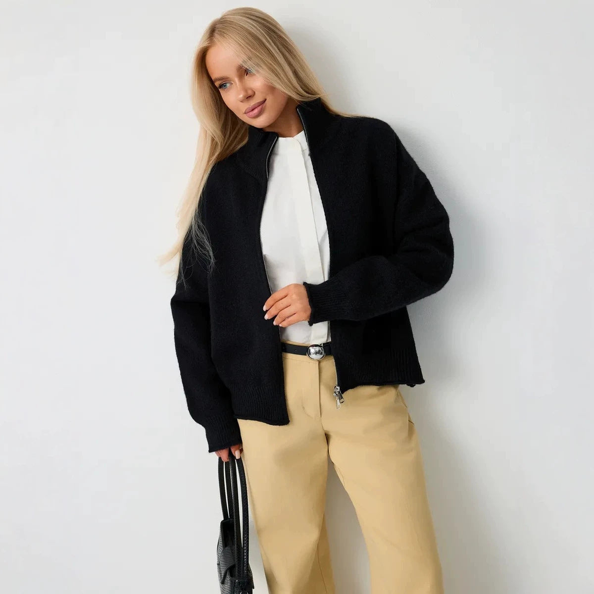 Women’s black knitted zip-up sweater cardigan with stand-up collar and ribbed cuffs