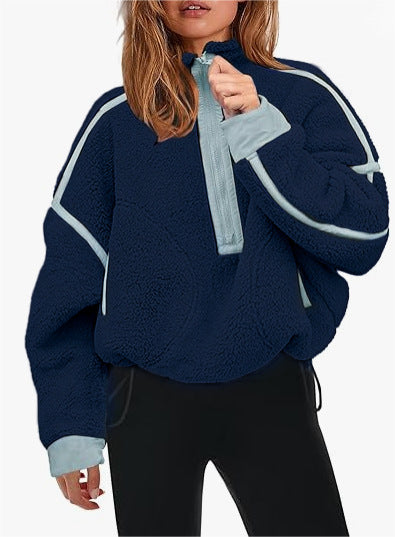 Plush quarter-zip sweatshirt in navy blue with light blue trim and pull tab