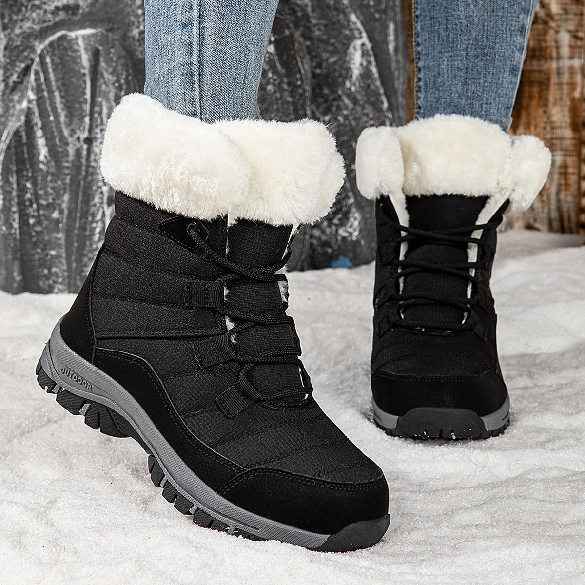 Women’s black mid-top winter snow boots with faux fur cuffs, lace-up, thick tread