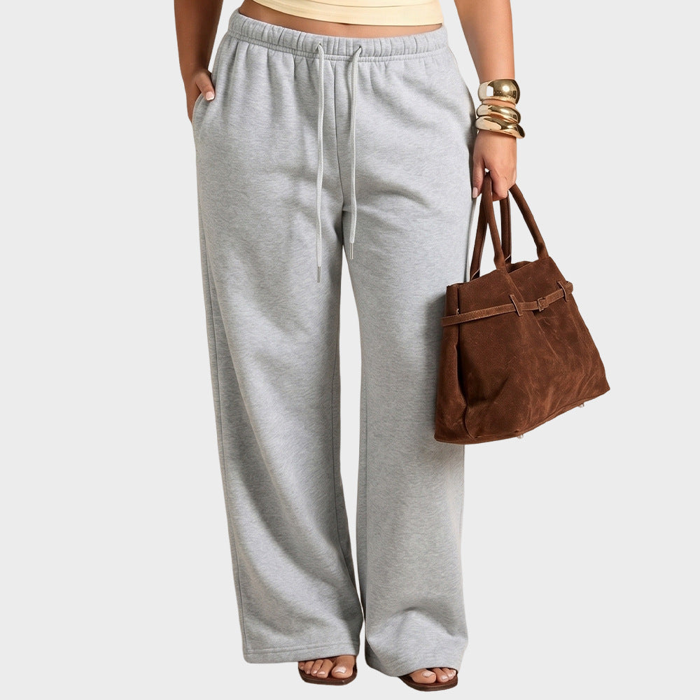 Grey wide-leg sweatpants, high-rise elastic waist with drawstring ties, loose long legs