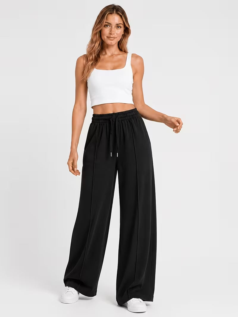 Black high-waisted wide-leg lounge pants with elastic waistband, full-length