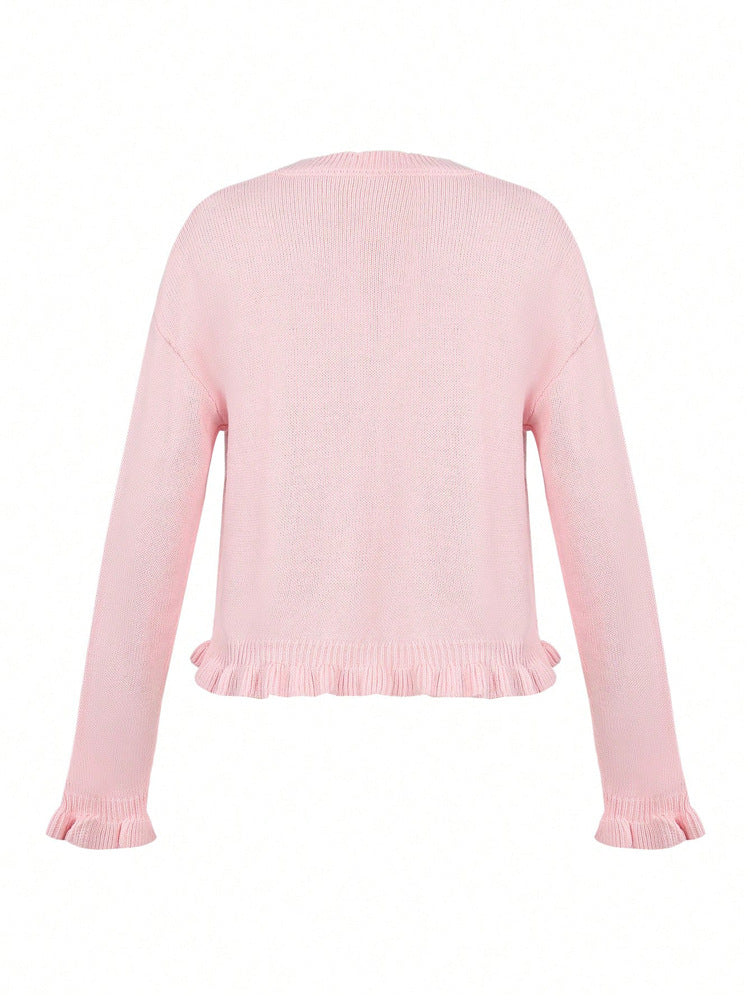 Pink knitted cardigan back view with ruffled hem and ribbed cuffs