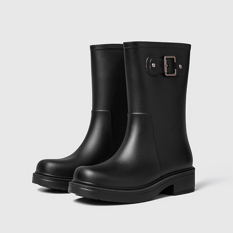 Women's black mid-calf rain boots with side buckle and flat sole