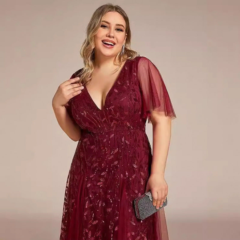 Wine red sequined mesh dress with V-neck and short sheer sleeves, side view