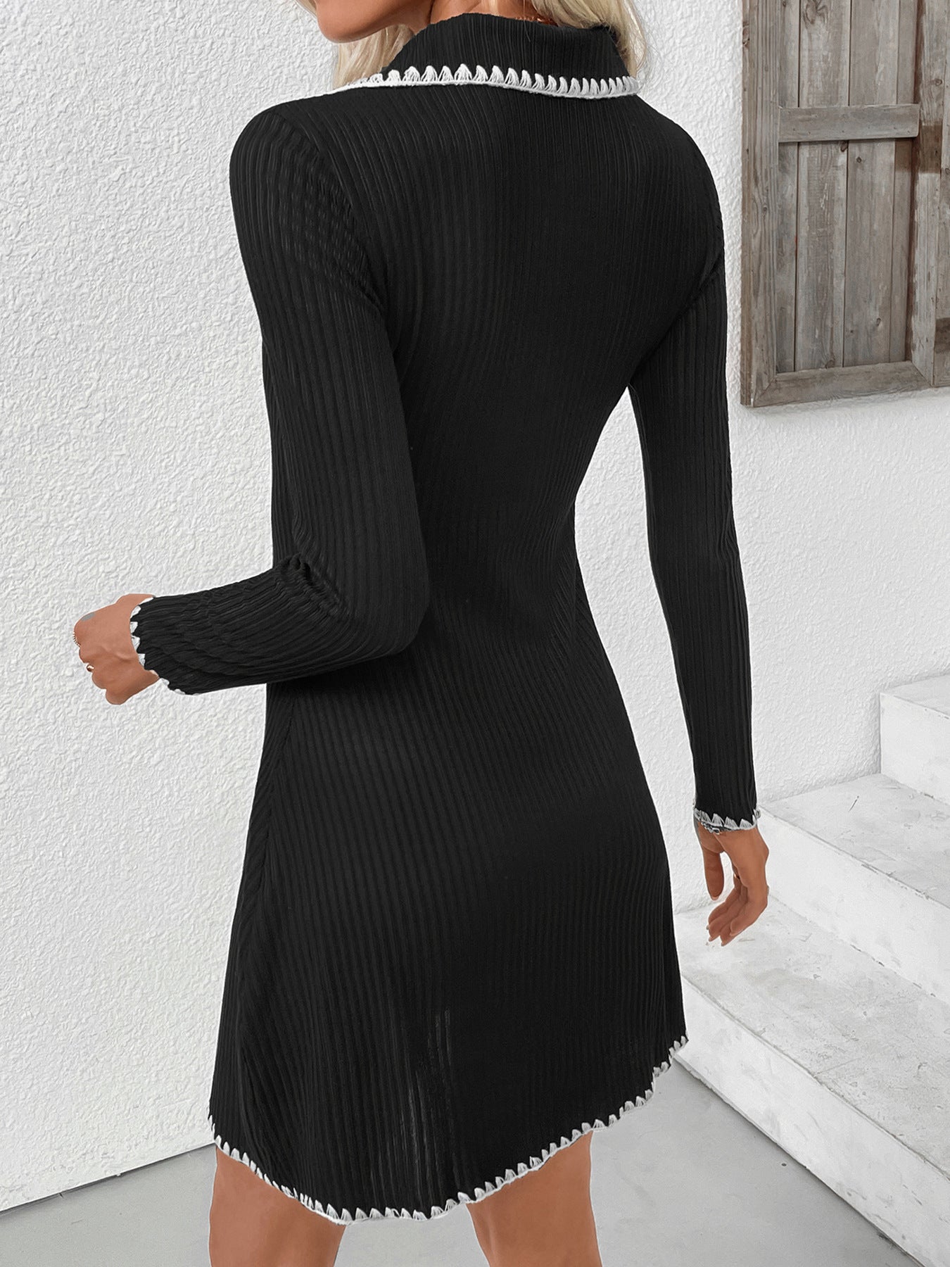 Black knit polo mini dress, long sleeves, contrast trim along hem and cuffs