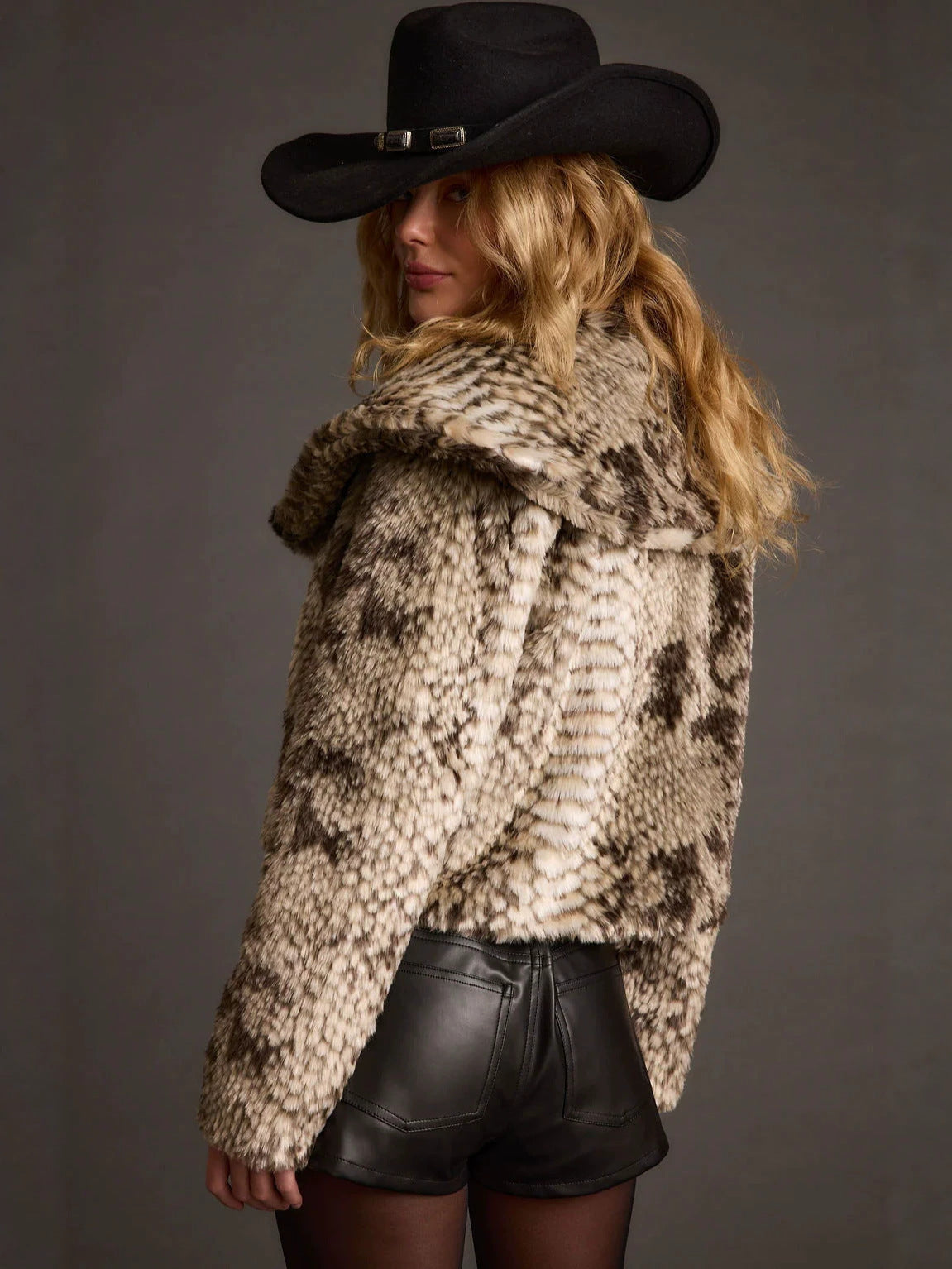 Snake print faux fur short coat with wide collar and belt-loop buckle, side view