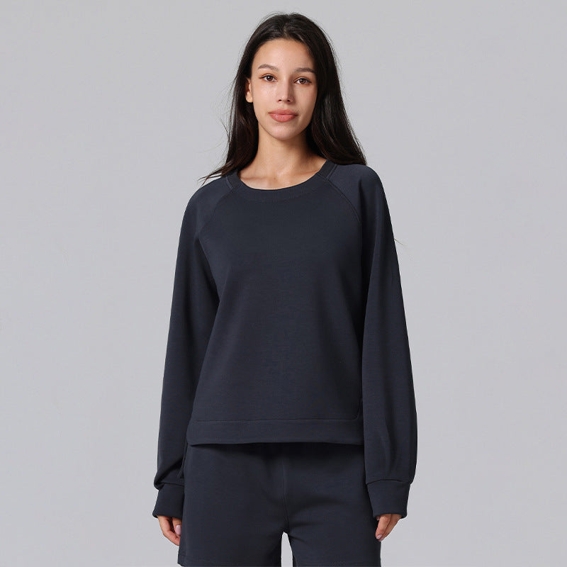 Dark navy relaxed-fit pullover with raglan sleeves and ribbed cuffs