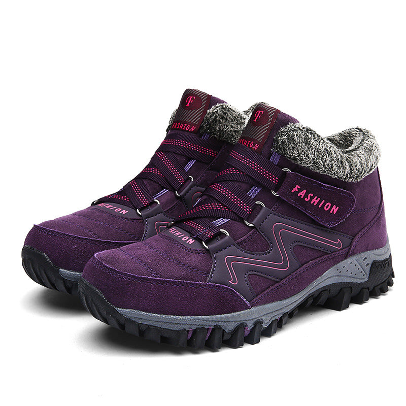Purple winter snow boots with faux fur collar, adjustable straps, and chunky traction tread