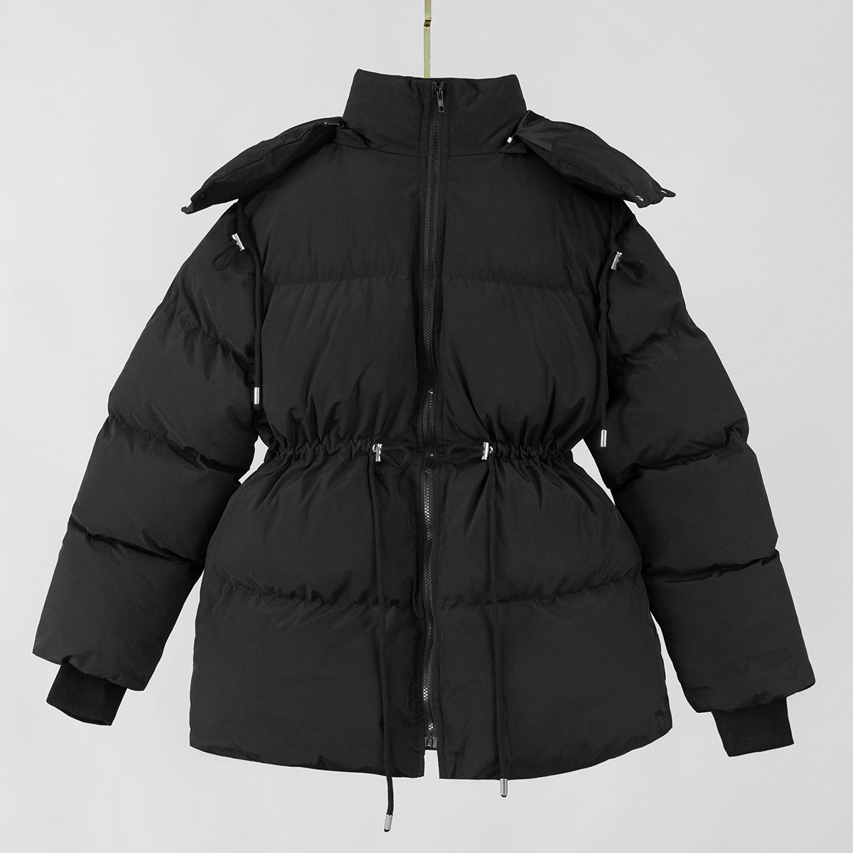 Black hooded puffer jacket on hanger with front zipper and drawstring waist detail