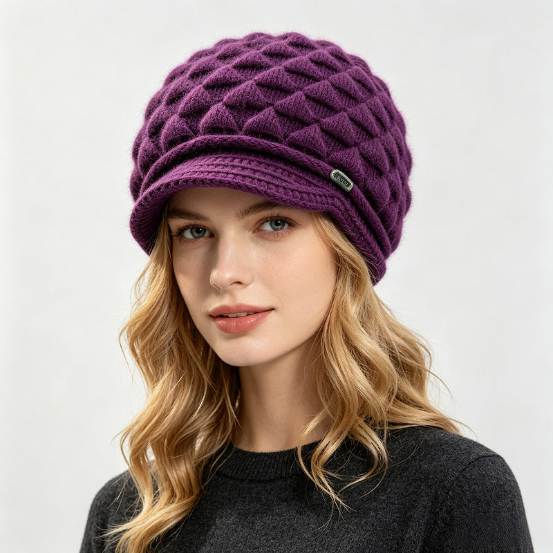 Purple fleece-lined knit beanie with quilted texture and ribbed cuff brim